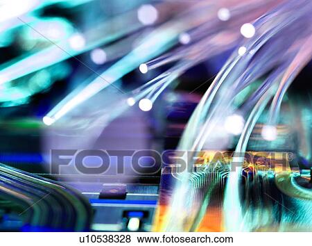 Fibre optic strands carrying data over electronic circuit board of laptop computer View Large Photo Image Stock Photo - Fibre optic strands carrying data over electronic circuit board of laptop computer. Fotosearch