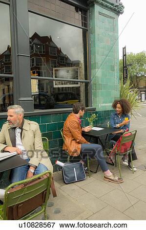 Friends at pavement cafe, London, UK View Large Photo Image Stock Photo - Friends at pavement cafe, London, UK. Fotosearch
