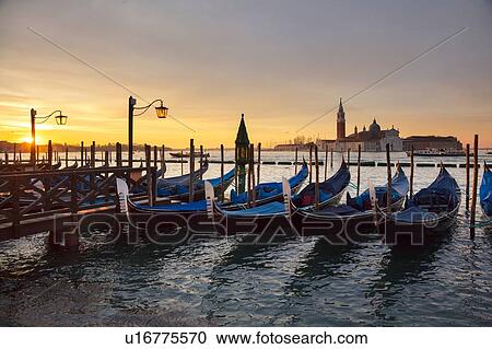 Gondolas by St Marks Square at sunrise, Venice, Veneto, Italy View Large Photo Image Stock Image - Gondolas by St Marks Square at sunrise, Venice, Veneto, Italy. Fotosearch