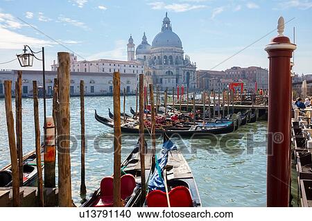 Gondolas on Grand canal near Saint Maria Della Salute church, Venice, Veneto, Italy View Large Photo Image Stock Image - Gondolas on Grand canal near Saint Maria Della Salute church, Venice, Veneto, Italy. Fotosearch