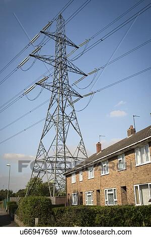 Stock Photo - High voltage transmission lines passing near to housing, West Midlands, UK.. Fotosearch