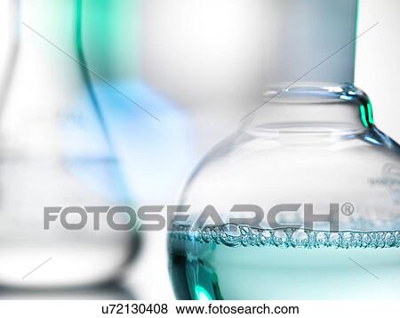 Laboratory beakers containing chemical formulas View Large Photo Image Stock Photo - Laboratory beakers containing chemical formulas. Fotosearch