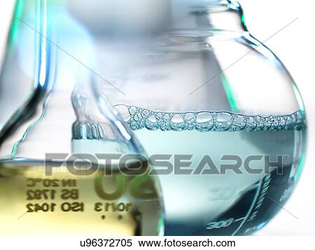 Stock Photography - Laboratory beakers containing chemical formulas. Fotosearch