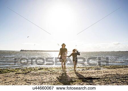Mother and daughter on beach View Large Photo Image Stock Photo - Mother and daughter on beach. Fotosearch