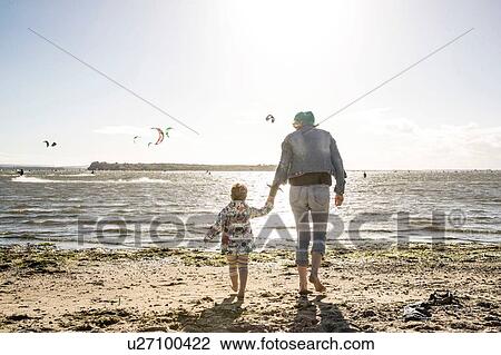 Mother and toddler girl on beach View Large Photo Image Stock Image - Mother and toddler girl on beach. Fotosearch