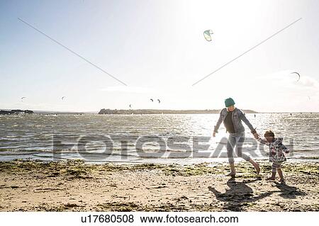 Mother and toddler girl on beach View Large Photo Image Stock Photo - Mother and toddler girl on beach. Fotosearch