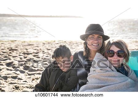 Picture - Mother with son and daughter on beach. Fotosearch