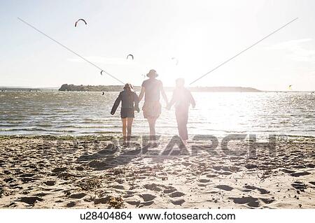 Mother with son and daughter on beach View Large Photo Image Picture - Mother with son and daughter on beach. Fotosearch