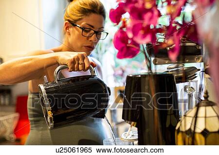 Pregnant mid adult woman making a drink in kitchen View Large Photo Image Stock Photography - Pregnant mid adult woman making a drink in kitchen. Fotosearch