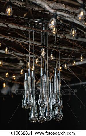 Retro decorative lights and glass chandelier hanging from rustic ceiling View Large Photo Image Stock Image - Retro decorative lights and glass chandelier hanging from rustic ceiling. Fotosearch