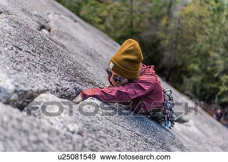 Stock Photo - Rock climber gripping onto cracks, Malamute, Squamish, Canada. Fotosearch