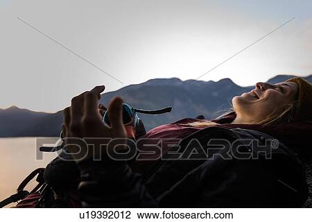 Rock climber lying down resting happy, Malamute, Squamish, Canada View Large Photo Image Stock Image - Rock climber lying down resting happy, Malamute, Squamish, Canada. Fotosearch