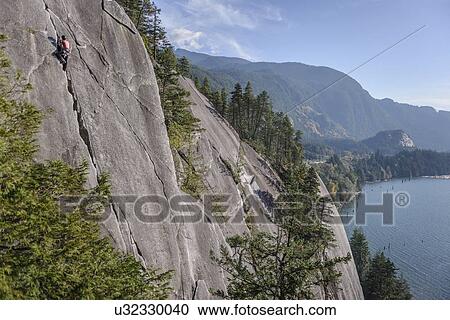 Rock climber scaling rock on Malamute, Squamish, Canada View Large Photo Image Stock Image - Rock climber scaling rock on Malamute, Squamish, Canada. Fotosearch