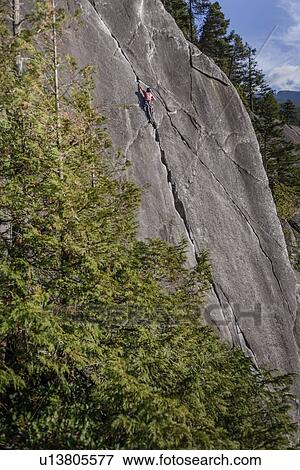 Rock climber scaling rock on Malamute, Squamish, Canada View Large Photo Image Stock Photo - Rock climber scaling rock on Malamute, Squamish, Canada. Fotosearch