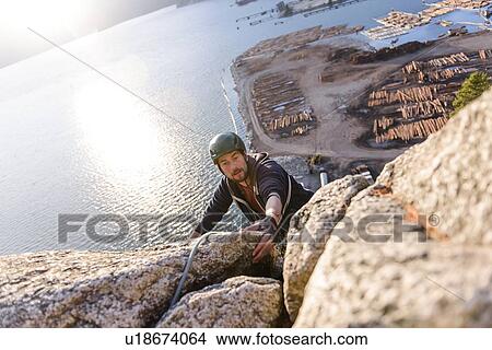 Picture - Rock climber using safety harness ropes, Malamute, Squamish, Canada. Fotosearch