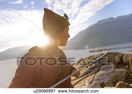 Stock Photo - Rock climber using safety harness ropes, Malamute, Squamish, Canada. Fotosearch