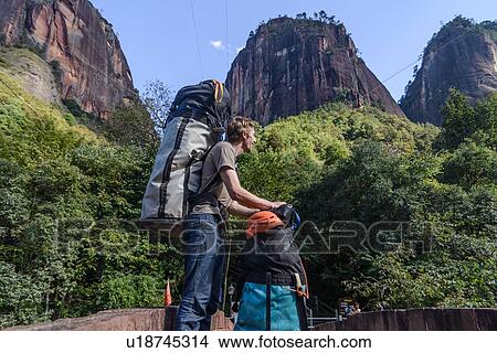 Rock climber with backpack and equipment, Liming, Yunnan, China View Large Photo Image Picture - Rock climber with backpack and equipment, Liming, Yunnan, China. Fotosearch