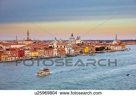 Picture - Scenic cityscape over Giudecca canal at sunset, Venice, Veneto, Italy. Fotosearch
