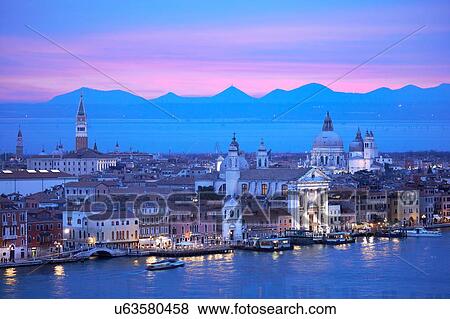 Stock Photo - Scenic cityscape over Giudecca canal at night, Venice, Veneto, Italy. Fotosearch
