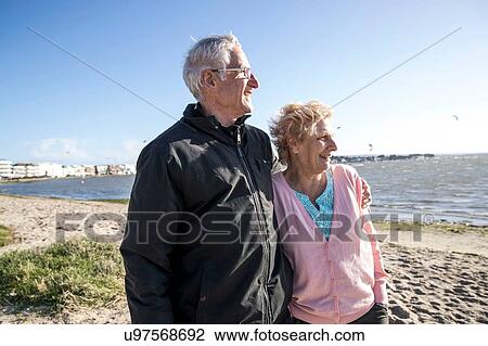 Senior adult couple enjoying beach View Large Photo Image Stock Image - Senior adult couple enjoying beach. Fotosearch