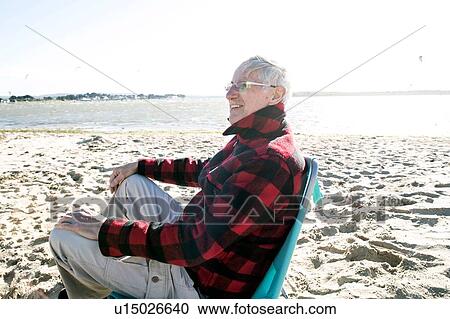 Stock Image - Senior adult man enjoying beach. Fotosearch