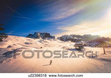 Stock Photo - Skier on snow covered slopes, Madonna di Campiglio, Trentino-Alto Adige, Italy. Fotosearch