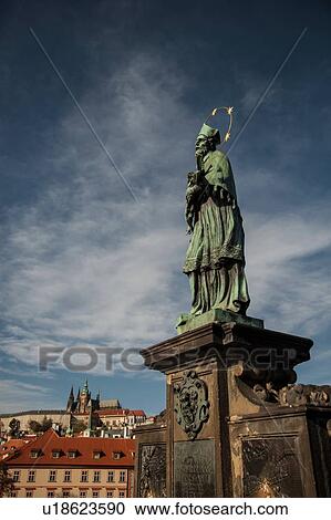 Stock Image - St. John of Nepomuk statue, Charles Bridge, Prague, Czech Republic. Fotosearch