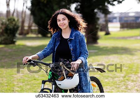 Teenage girl on pushbike View Large Photo Image Stock Image - Teenage girl on pushbike. Fotosearch