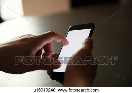 Texting on cellphone in dark View Large Photo Image Stock Photo - Texting on cellphone in dark. Fotosearch
