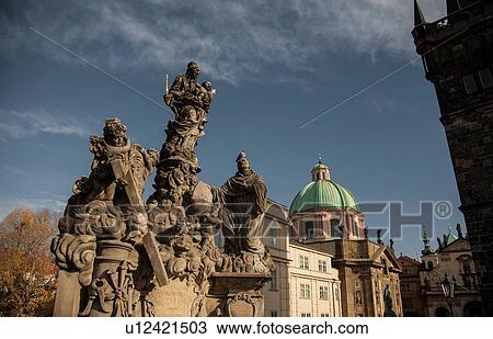 Stock Image - The Virgin with Saint Bernard statues, Charles Bridge, Prague, Czech Republic. Fotosearch