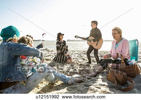 Three generation family enjoying beach View Large Photo Image Stock Image - Three generation family enjoying beach. Fotosearch