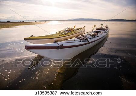 Stock Photo - Two kayaks side by side, Quadra Island, Campbell River, Canada. Fotosearch