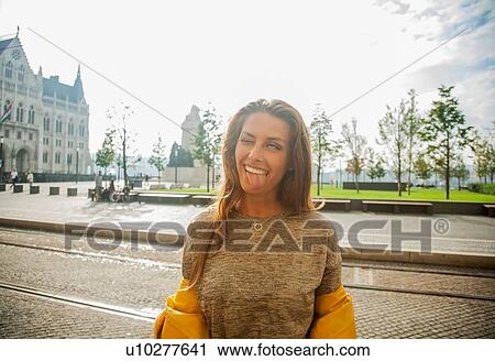 Stock Image - Woman making faces, Budapest, Hungary. Fotosearch