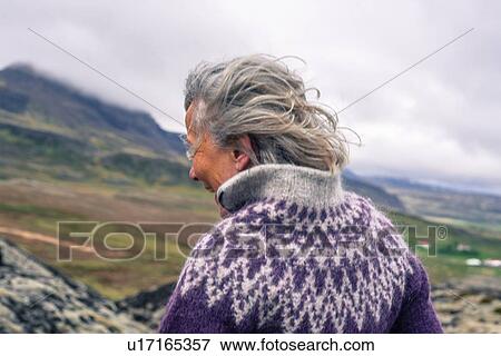 Woman walking around Grabrok volcano, Iceland View Large Photo Image Stock Photo - Woman walking around Grabrok volcano, Iceland. Fotosearch