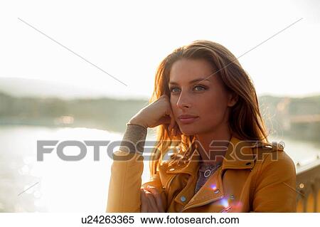 Stock Photography - Woman with bright sunlight in background. Fotosearch