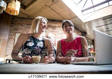 Women brainstorming business ideas in restaurant View Large Photo Image Stock Image - Women brainstorming business ideas in restaurant. Fotosearch