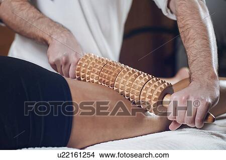 Anti-cellulite maderotherapy massage View Large Photo Image Picture - Anti-cellulite maderotherapy massage. Fotosearch