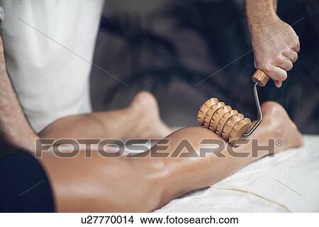 Picture - Anti-cellulite maderotherapy massage. Fotosearch
