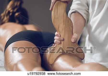 Anti-cellulite maderotherapy massage View Large Photo Image Stock Photo - Anti-cellulite maderotherapy massage. Fotosearch