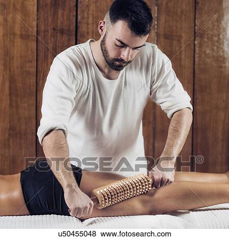 Anti-cellulite maderotherapy massage View Large Photo Image Stock Photo - Anti-cellulite maderotherapy massage. Fotosearch