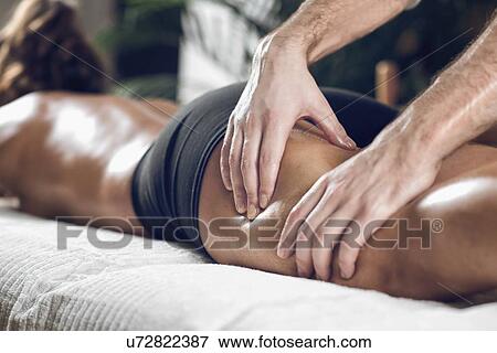 Stock Photo - Anti-cellulite maderotherapy massage. Fotosearch