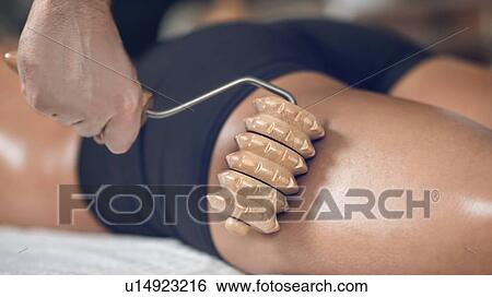Anti-cellulite maderotherapy massage View Large Photo Image Stock Photograph - Anti-cellulite maderotherapy massage. Fotosearch