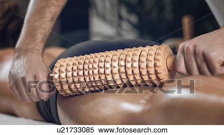 Stock Photography - Anti-cellulite maderotherapy massage. Fotosearch