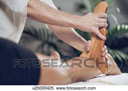 Stock Photography - Anti-cellulite maderotherapy massage. Fotosearch
