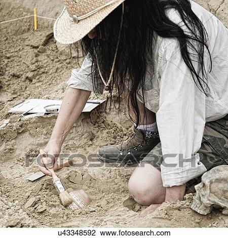 Archaeologist excavating pottery View Large Photo Image Stock Image - Archaeologist excavating pottery. Fotosearch