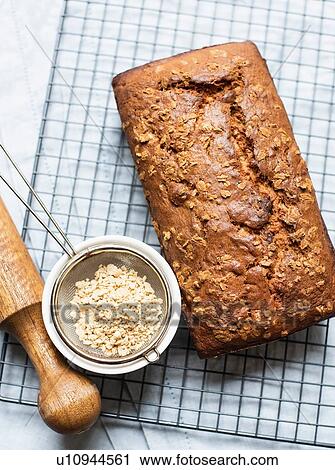 Banana bread on cooling rack and maple flakes View Large Photo Image Stock Image - Banana bread on cooling rack and maple flakes. Fotosearch