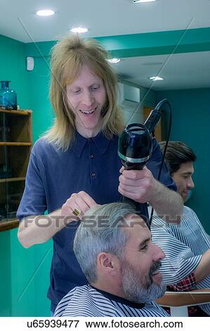 Barber working in barbershop View Large Photo Image Stock Photo - Barber working in barbershop. Fotosearch