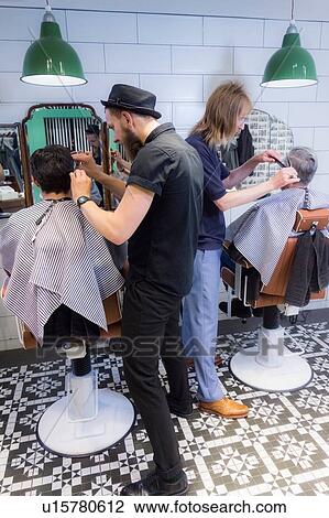 Barbers working in barbershop View Large Photo Image Stock Image - Barbers working in barbershop. Fotosearch