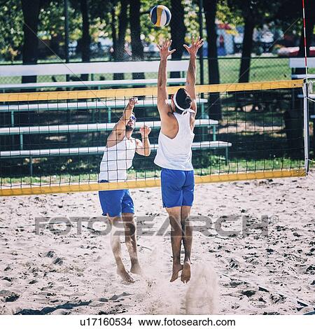 Beach volleyball game View Large Photo Image Picture - Beach volleyball game. Fotosearch