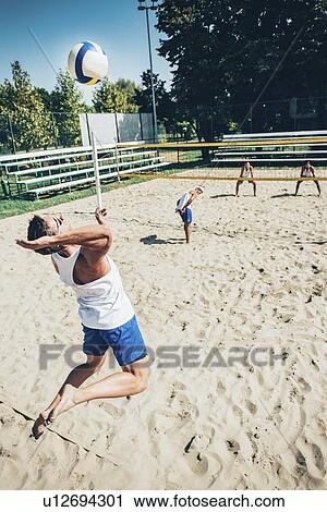 Beach volleyball game View Large Photo Image Stock Image - Beach volleyball game. Fotosearch